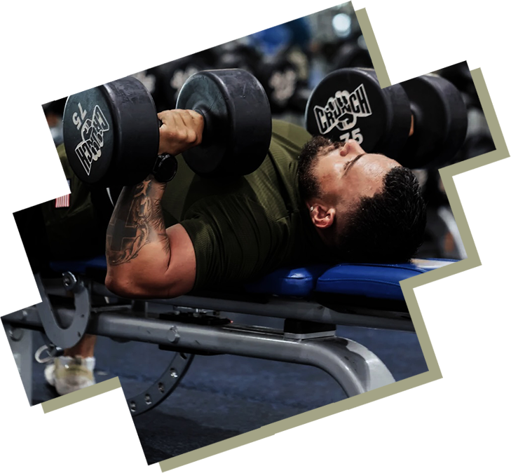 A man is lifting some weights on the bench